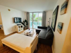 a living room with a couch and a table at Miami Hollywood Great 2 Bedroom 2 Bathroom with Intercostal View 001-22bvic in Hollywood