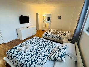 a small bedroom with two beds and a tv at Miami Hollywood Great 2 Bedroom 2 Bathroom with Intercostal View 001-22bvic in Hollywood +21 photos