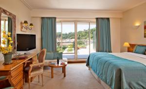 Cama ou camas em um quarto em Hotel Dos Templarios