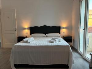 Postel nebo postele na pokoji v ubytování Jimy House