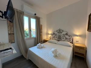 Postel nebo postele na pokoji v ubytování Jimy House