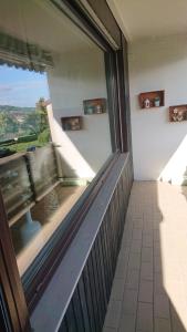 a balcony with a large window in a building at Ferienwohnung Danny in Bad Sachsa