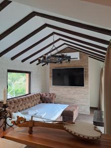 TV a/nebo společenská místnost v ubytování La Villa Casa