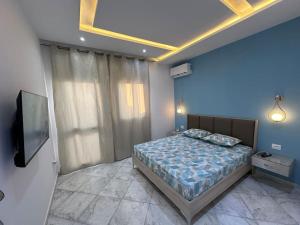 Postel nebo postele na pokoji v ubytování Blue'ming Sousse