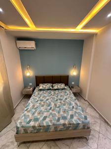 Postel nebo postele na pokoji v ubytování Blue'ming Sousse
