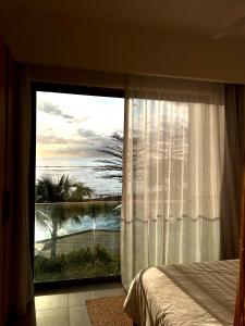 Postelja oz. postelje v sobi nastanitve Beachfront Apartment Ocean Point