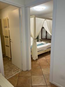 Postel nebo postele na pokoji v ubytování Residenza Catullo