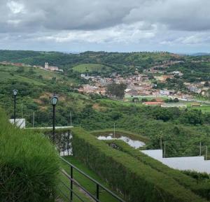 a view of a city from the top of a hill at Chalé Nevada 310 in Bananeiras