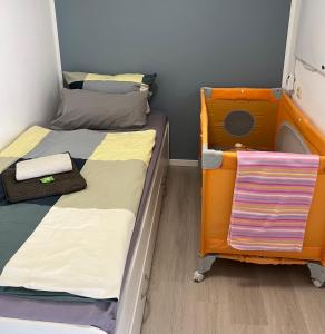 two twin beds in a room with a dresser at CASALINO DI ANNA in Wensickendorf