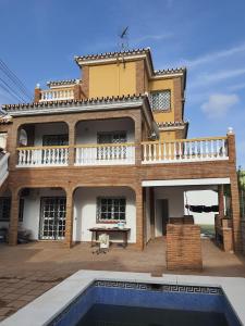 a house with a swimming pool in front of it at UF holiday Villa in Málaga