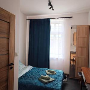 Postel nebo postele na pokoji v ubytování MH Apartment + 8 fotografií