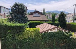 a view of a house with a roof at FLEUR De LYS - PROCHE CENTRE VILLE ET LAC in Thonon-les-Bains