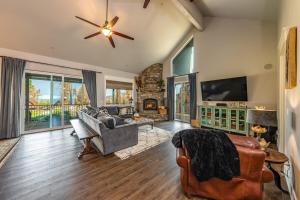 a living room with a couch and a fireplace at The Great Escape Sunsets Hot Tub Bliss in Shaver Lake