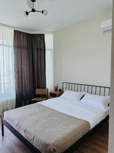 Postel nebo postele na pokoji v ubytování Cozy Rooms with View, Sighnaghi