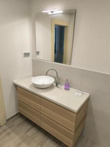 a bathroom with a sink and a mirror at Apartmán Pohoda Zvolen in Zvolen