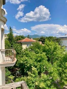 a view from a balcony of a house with trees at Balkan Aparts in Hisarya