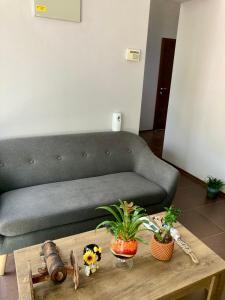 a living room with a couch and a coffee table at Balkan Aparts in Hisarya