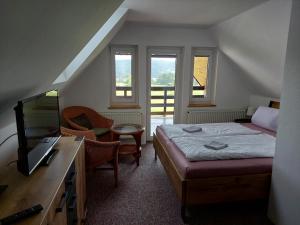 Postel nebo postele na pokoji v ubytování Penzion SLUPEČNÁ