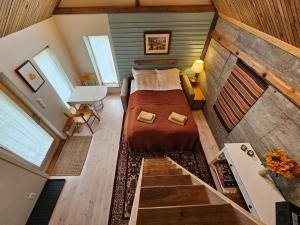 Ένα ή περισσότερα κρεβάτια σε δωμάτιο στο Sigurd's Tiny House