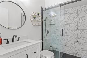 a bathroom with a shower and a toilet and a sink at Windfield Condo In The Entertainment District in Scottsdale +25 photos