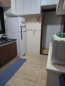 Kuchyň nebo kuchyňský kout v ubytování Apartamento Inteiro Rodeio Jaguariúna com 2 quartos + 6 fotografií