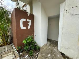 a building with a sign on the side of it at Departamento céntrico Huatulco in Santa Cruz Huatulco