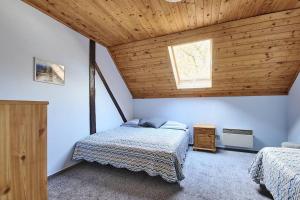 Una cama o camas en una habitación de Chalupa Radovanka