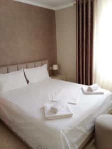 Postel nebo postele na pokoji v ubytování Stela Apartment