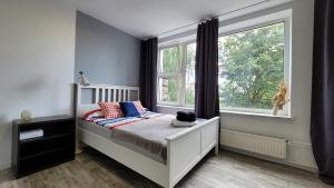 Postel nebo postele na pokoji v ubytování Apartamenty Parkowe nr 6