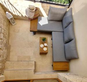 an overhead view of a couch and a table at Stone house Sprtini-Brač in Ložišće