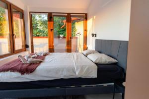 Postel nebo postele na pokoji v ubytování Sunset Home