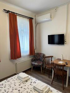 TV a/nebo společenská místnost v ubytování Yellowhouse Room 2