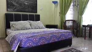 Postel nebo postele na pokoji v ubytování Roemahkoe Holidayhome