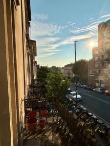 a balcony with a row of plants on a building at Clifton Apartment in Bristol