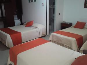 Postel nebo postele na pokoji v ubytování Hotel Napolitano