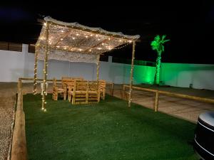 a table and chairs under a tent with lights at Villa Cala Del Plomo in Almería