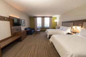a hotel room with two beds and a flat screen tv at Holiday Inn Express - Grand Island by IHG in Niagara Falls