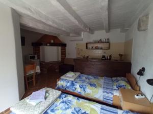 a bedroom with two beds in a room at Apartmani Bartulasi in Roč