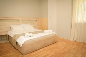 Letto o letti in una camera di Hotel Martini Kvariati