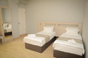 Letto o letti in una camera di Hotel Martini Kvariati