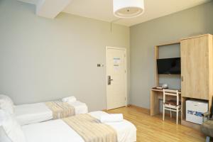 Letto o letti in una camera di Hotel Martini Kvariati