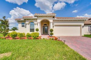 a large house with a garage at Relax, Play, Swim Luxe Haines City Home with Lanai! in Haines City