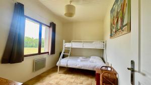 Ένα ή περισσότερα κρεβάτια σε δωμάτιο στο DOMAINE SOLAYA