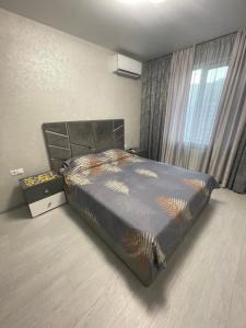 Ένα ή περισσότερα κρεβάτια σε δωμάτιο στο VIP new apartment Odessa