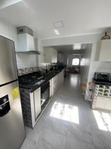 Kuchyň nebo kuchyňský kout v ubytování Habitación casa Andy