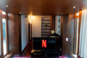 a chair with the letter n on it in a room at Seaside Cozy Apartment with private Terrace in Porto