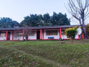 a man standing in front of a house at Hotel Eco Tours Tariquia in Bermejo