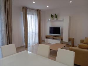TV a/nebo společenská místnost v ubytování B&B Guesthouse La Casetta Di Sutri sulla Francigena