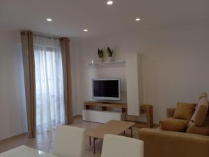 TV a/nebo společenská místnost v ubytování B&B Guesthouse La Casetta Di Sutri sulla Francigena