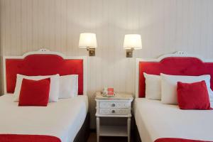 Postel nebo postele na pokoji v ubytování Ramada by Wyndham Buenos Aires Centro